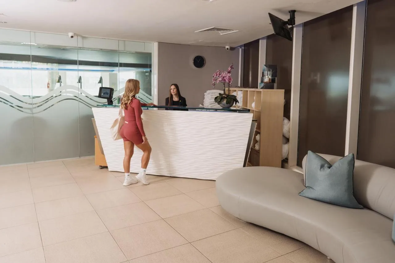 two women standing at a counter in a salon at voco St. David's Cardiff by IHG in Cardiff